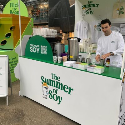 Barista standing at a mobile coffee bar branded The Summer of Soy by D4 Coffee